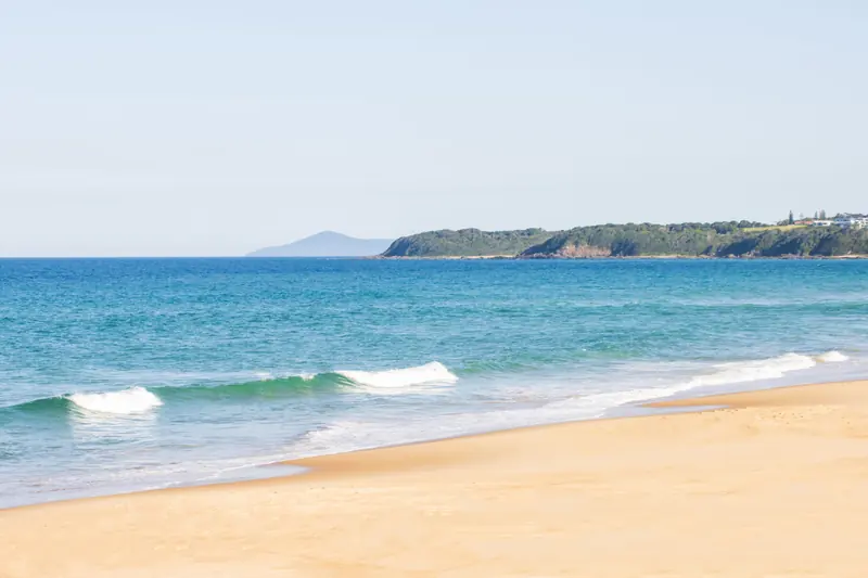 Waves along the sandy shoreline at Diamond Beach